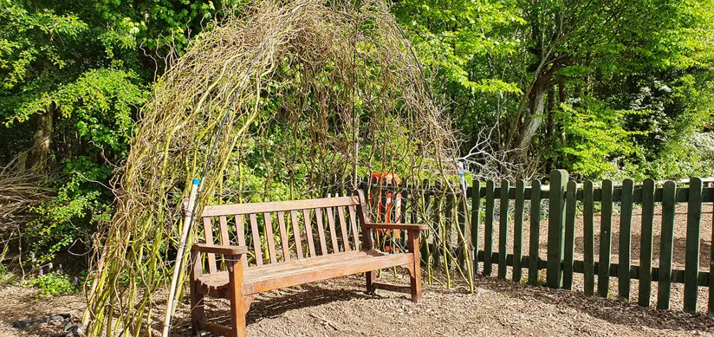 wooden_bench_in_garden_in_east_sussex_horam_manor_seller_leisure